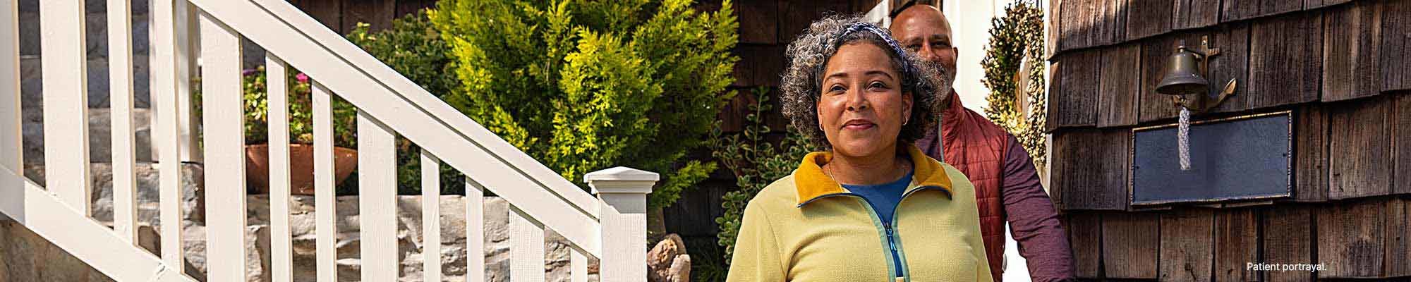 An image of a man and a woman walking outside.