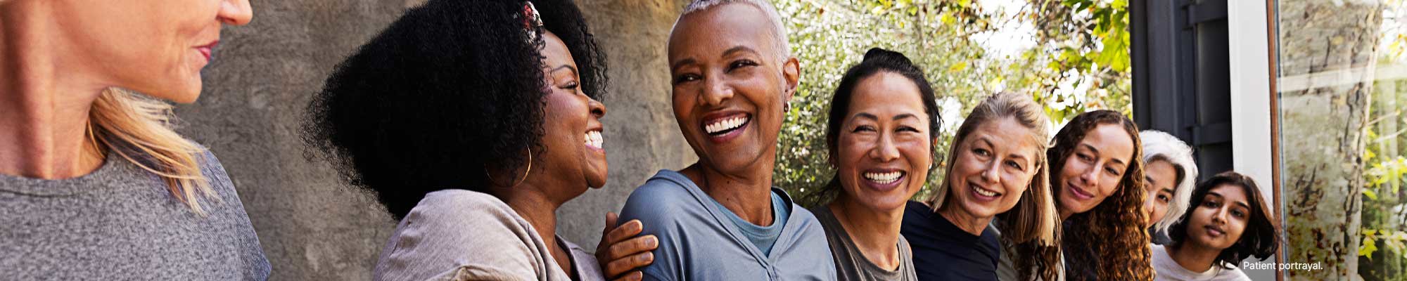Image of A group of women in workout gear sitting together after a yoga class.