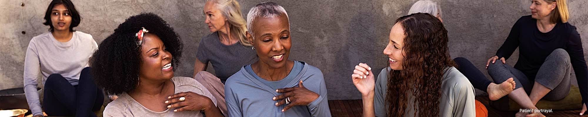 Image of a woman interacting with a group of other women